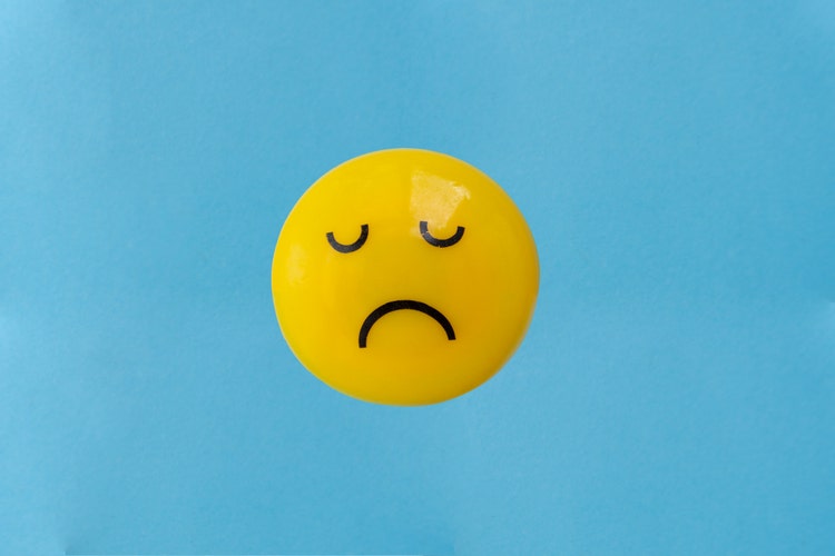 yellow emoji with sad face gesture